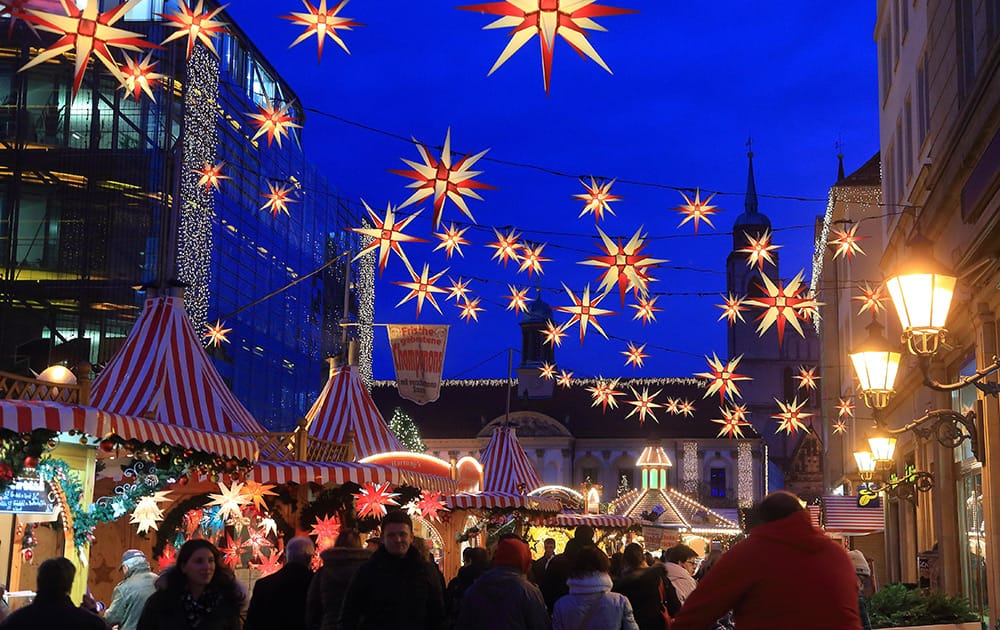 People enjoy a stroll at the Christmas market in Magdeburg, eastern Germany.