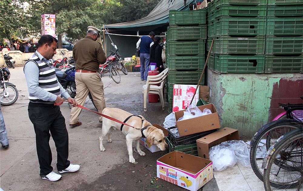 Police and bomb squad personnel inspect the nearby areas of Huda City centre metro station after a bomb hoax was received in Gurgaon.