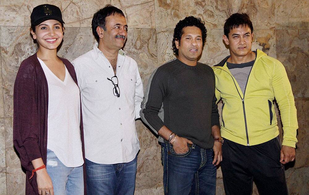 Cricket legend Sachin Tendulkar with actors Aamir Khan, Anushka Sharma and prducer Rajkumar Hirani during the screening of film PK in Mumbai.