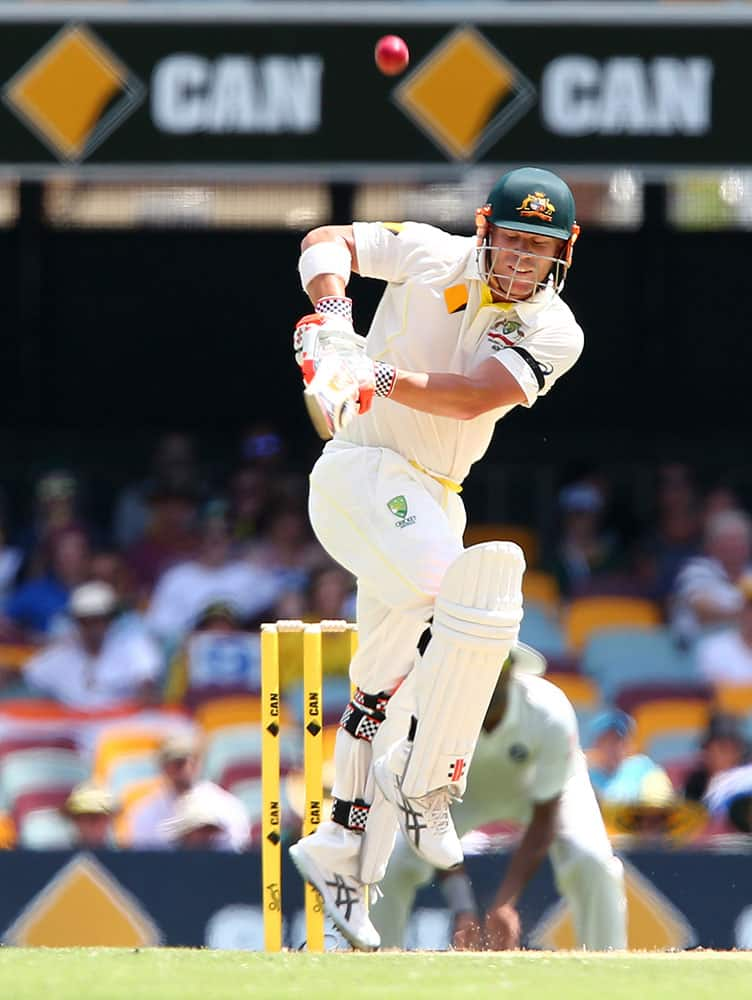 Australia's David Warner plays out a ball to be out caught for 29 runs during play on day two of the second cricket test in Brisbane, Australia.