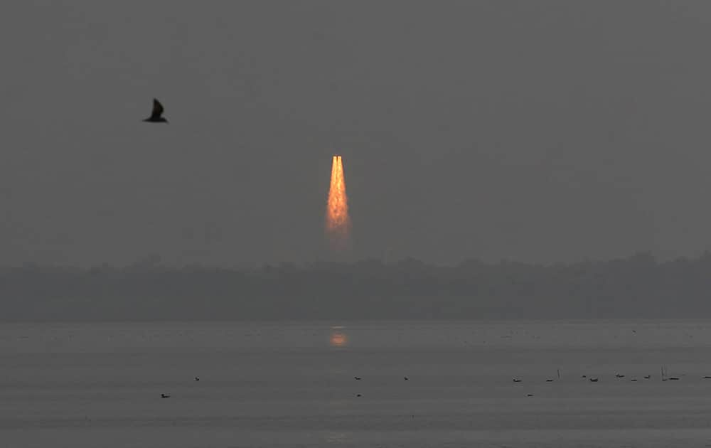 Indian Space Research Organisation’s Geosynchronous Satellite Launch Vehicle (GSLV Mark-III) rocket lifts off carrying CARE (Crew Module Atmospheeric Re-entry Experiment) from the east coast island of Sriharikota.