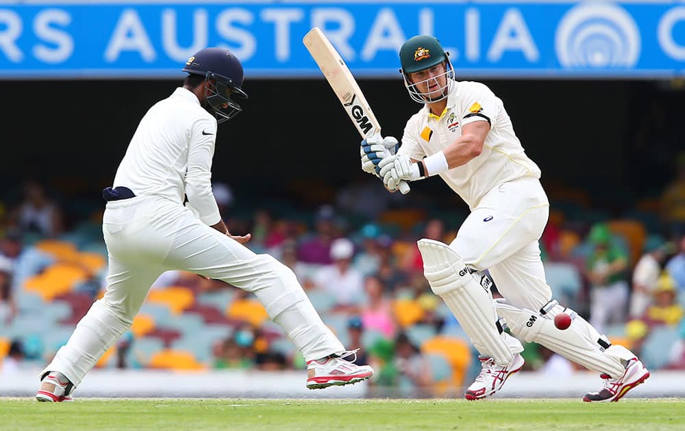 Australian batsman Shane Watson plays a shot during play on day two of the second cricket test against India in Brisbane, Australia.