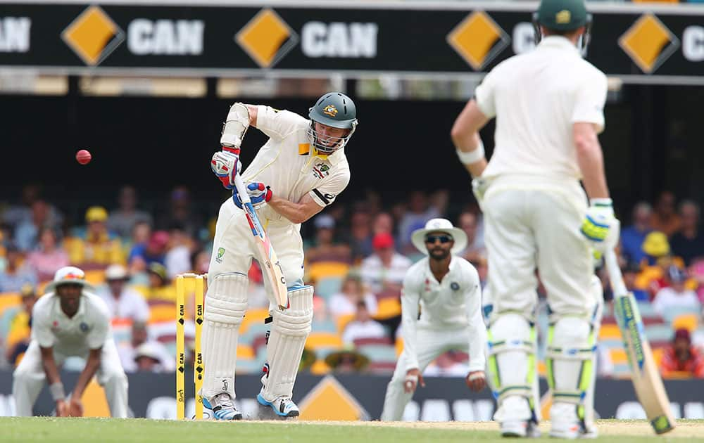 Australian batsman Chris Rogers plays at the ball to be caught behind for 55 runs during play on day two of the second cricket test against India in Brisbane, Australia.