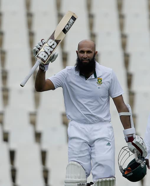 South Africa's captain Hashim Amla, rises his bat after reaching his double century on the second day of their 1st cricket test match against West Indies at Centurion Park in Pretoria, South Africa.