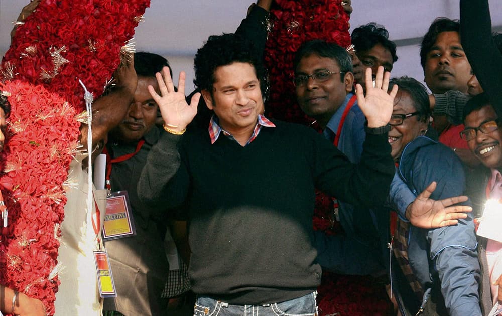 Sachin Tendulkar is garlanded during inauguration of a Swimming centre in North 24 Pargana district in West Bengal.