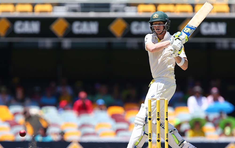 Australia's Steven Smith plays a hook shot on the third day of the second cricket test against India in Brisbane, Australia.