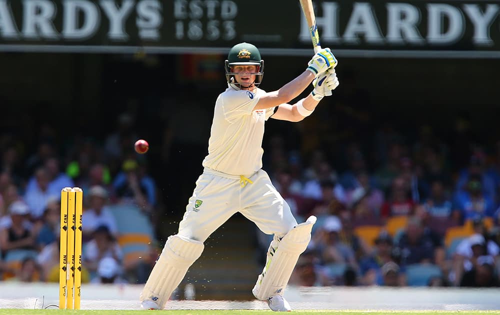 Australia's Steve Smith plays a shot on the third day of the second cricket test against India in Brisbane, Australia.