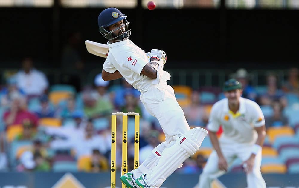 Shikhar Dhawan avoids a bouncer on day three of the second cricket test between Australia and India in Brisbane, Australia.