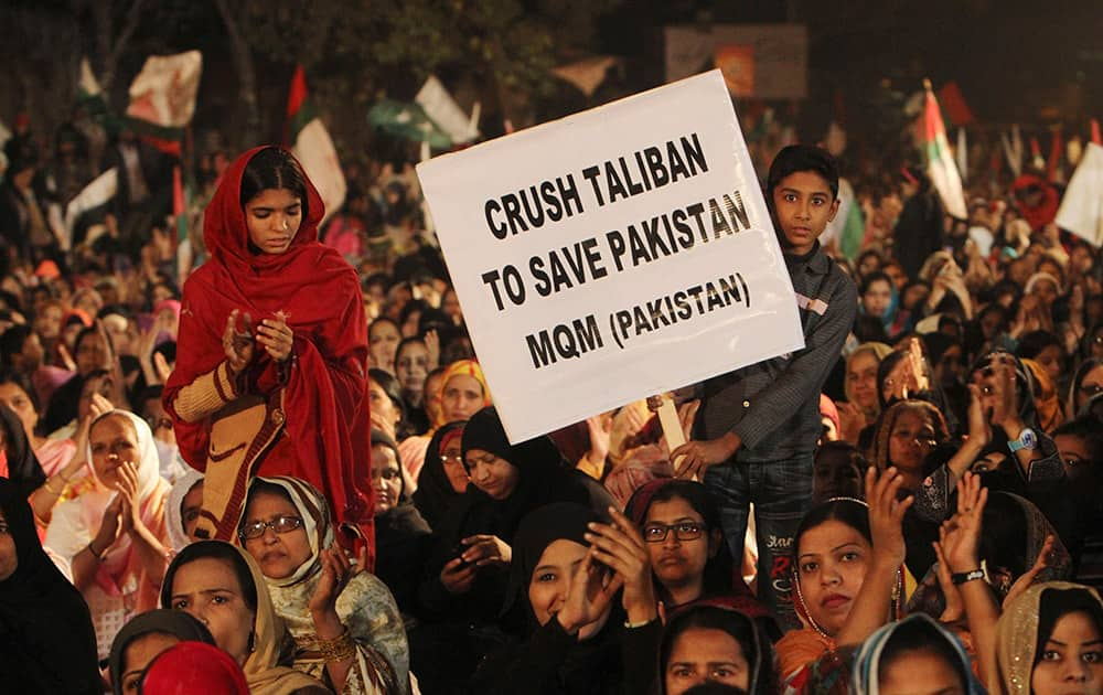 Supporters of Pakistan's political party Muttahida Qaumi Movement express solidarity with families of the students killed in Tuesday's Taliban attack on a military-run school in Peshawar, as they rally in Karachi, Pakistan.