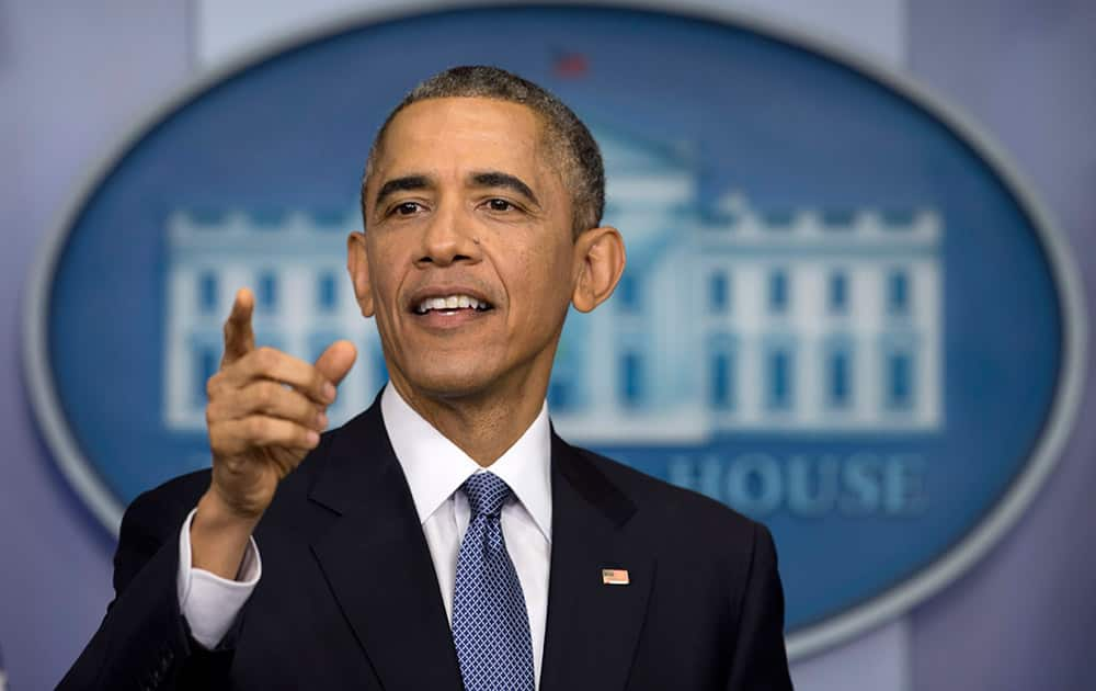 President Barack Obama gestures during a news conference in the Brady Press Briefing Room of the White House in Washington.