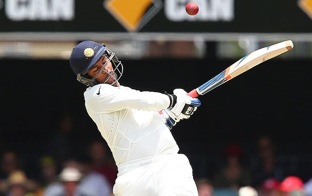 Umesh Yadav plays a shot during their play on day four of the second cricket test against Australia in Brisbane.