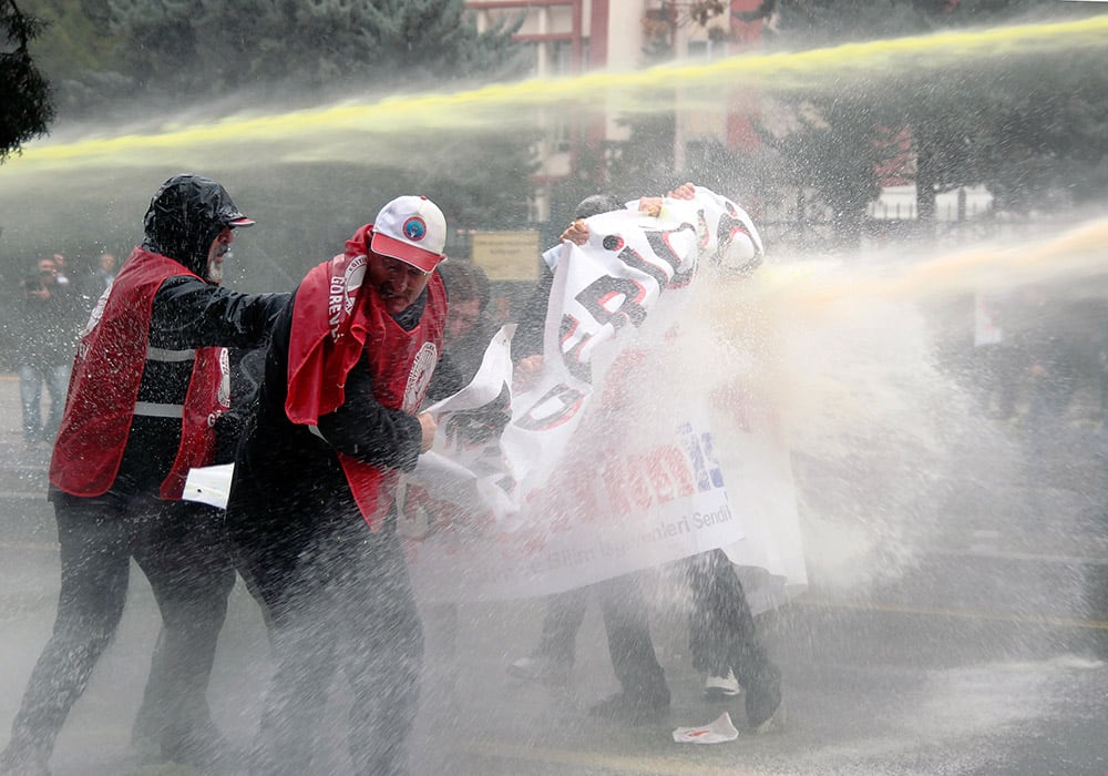 Riot police use water cannons and tear gas to disperse members of Turkish Teachers' Union who were protesting against the government's education and economy policies and corruption, in Ankara, Turkey.