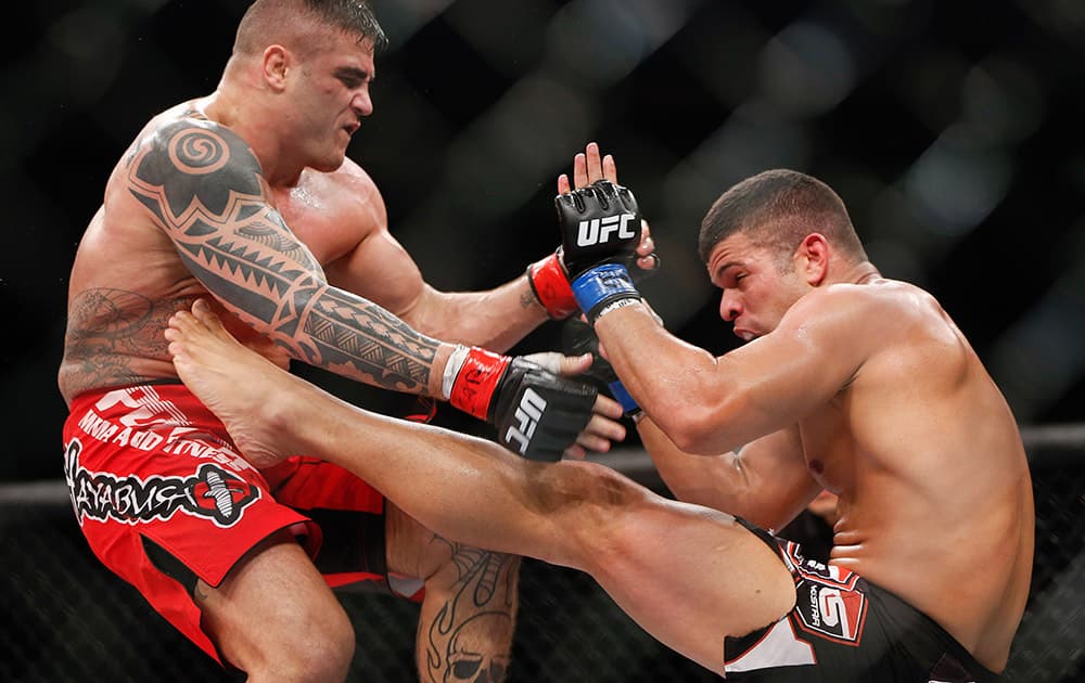 Daniel Serafian from Brazil, fights Antonio dos Santos, also from Brazil, during their middleweight mixed martial arts bout at UFC in Barueri, on the outskirts of Sao Paulo, Brazil.