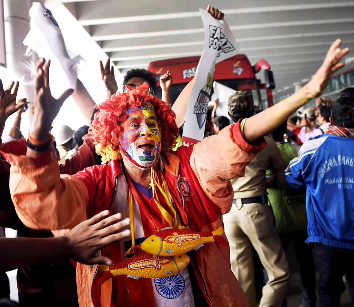 Supporters of Atletico De Kolkata football team rejoice after the teams victory in Indian Super League in Kolkata.