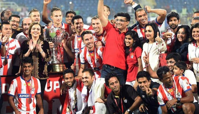 Former Indian cricket captain and co-owner of ISL franchise Atletico de Kolkata Sourav Ganguly and his team pose for a picture as they celebrate after winning the Indian Super League final match against Kerala Blaster FC in Navi Mumbai on Saturday. ISL founding chairperson Nita Ambani is also seen. 