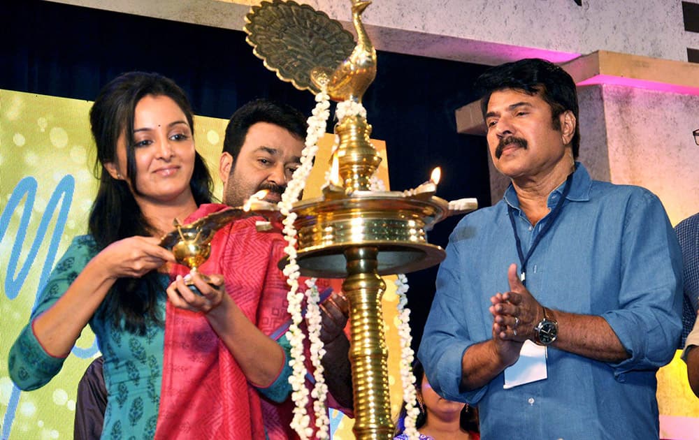 Actress Manju Variyar lights the inaugural lamp during the FEFKA Cinema Still Photographers union meeting in Kochi.