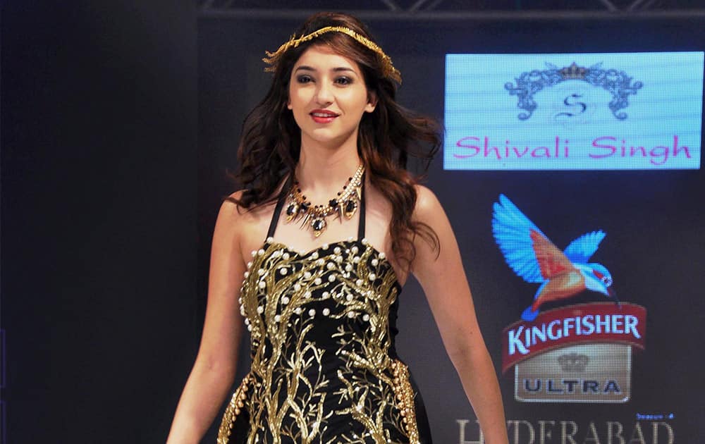 A model walks the ramp during a fashion show in Hyderabad.