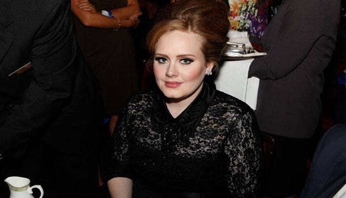 Adele misses Elton John&#039;s wedding, apologises