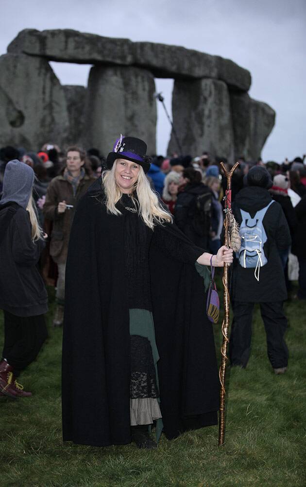 People gather at the historic site of Stonehenge, southwest England to celebrate the Winter solstice Monday.