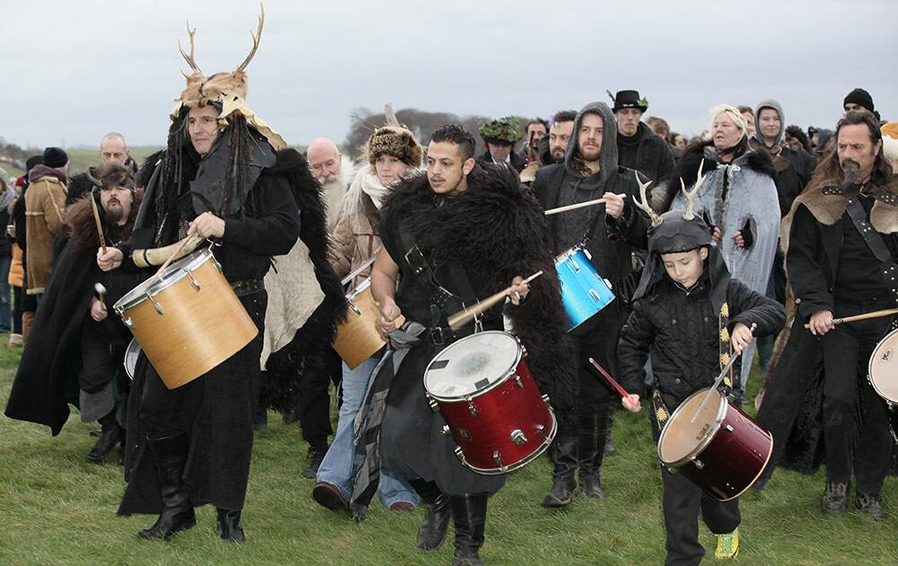 People gather at the historic site of Stonehenge, southwest England to celebrate the Winter solstice Monday.