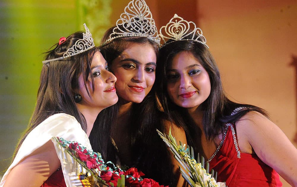 Bihar Neha Singh (Centre) with first runner-up Tanya (left) and second runner-up Ruchi Singh (right) pose during Freedom Miss Bihar contest at S.K. Memorial hall in Patna.