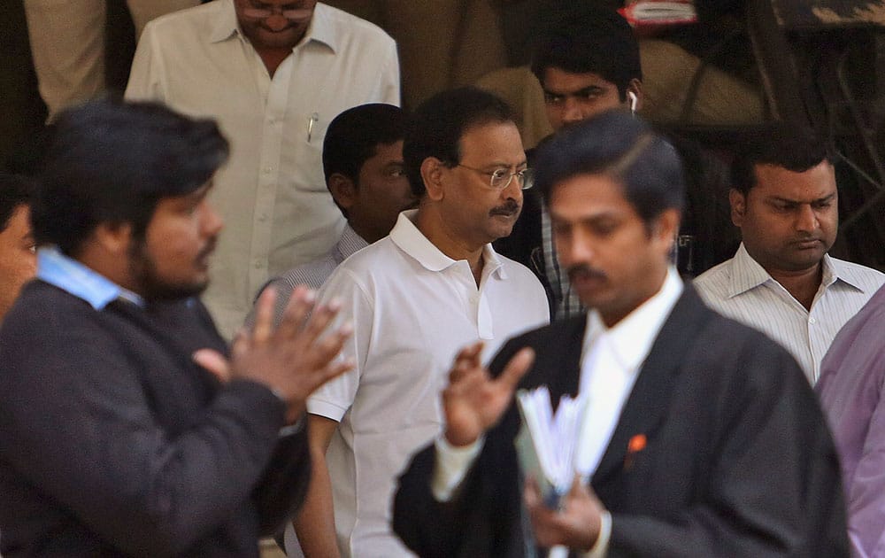 Satyam Computer Services founder B. Ramalinga Raju, leaves a court in Hyderabad.