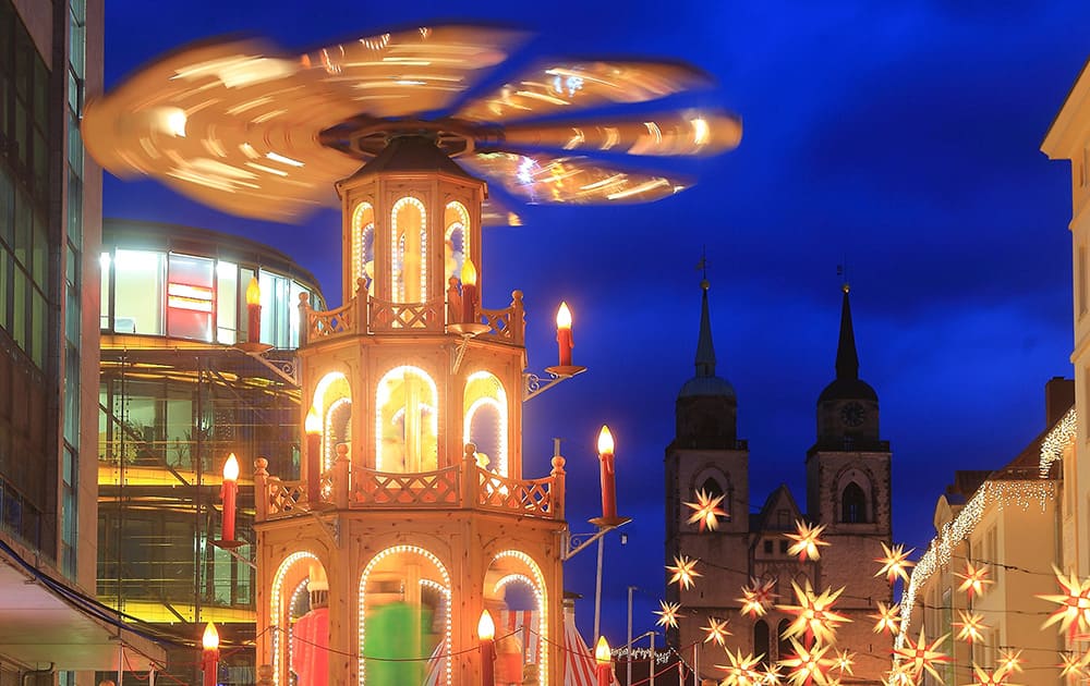 Christmas pyramid spins at the Christmas market in Magdeburg, Germany.