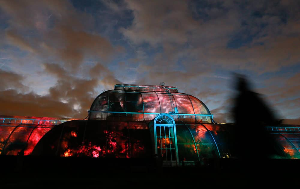 The Palm House is lit up by Christmas lights at the Royal Botanic Gardens, Kew in London.