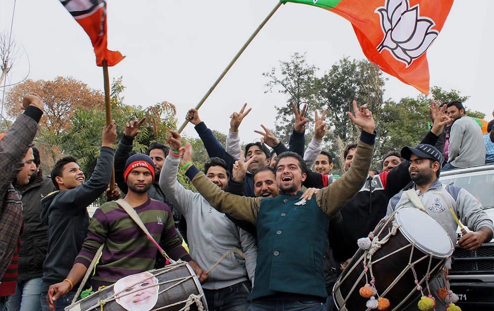 BJP party workers celebrate after J&K results at Polytechnic college in Jammu.