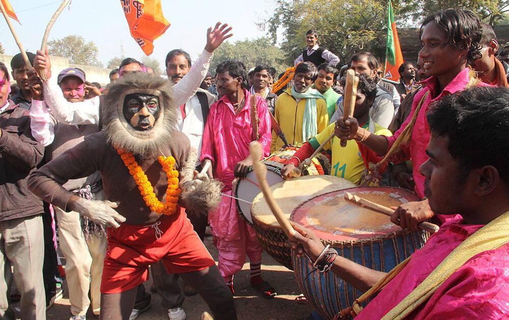 BJP supporters celebrate their party's win in Jharkhand Assembly polls in front of counting station in Ranchi.