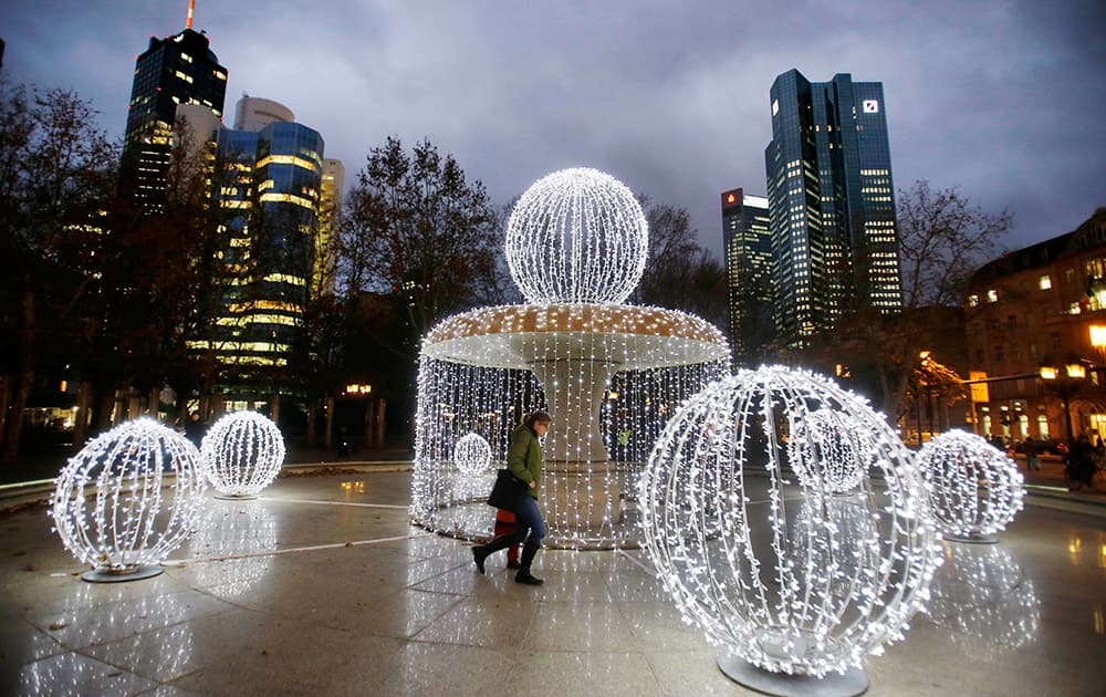 Strings of lights are fixed at the fountain in front of the ban towers in Frankfurt, Germany.