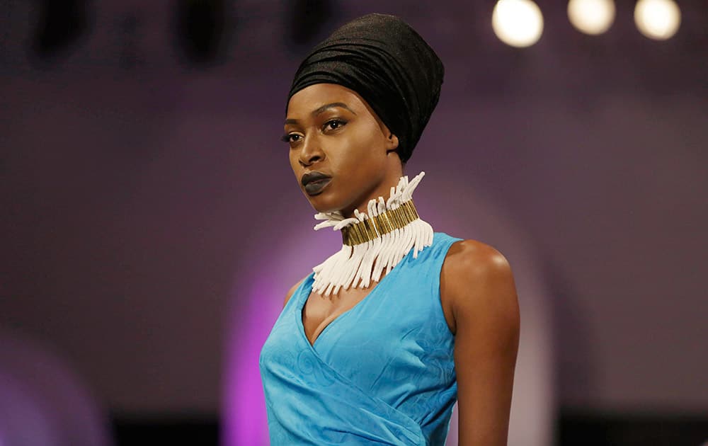 A model displays an outfit by designer Kikoromeo during the Music Meets Runway African fashion show in Lagos, Nigeria.