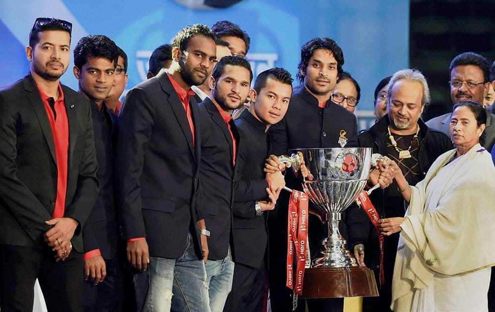 West Bengal Chief Minister Mamata Banerjee with the players of Atletico De Kolkata during a felicitation ceremony, in Kolkata.