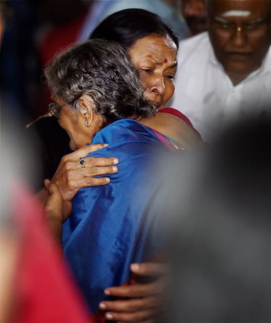 Director K Balachanders wife Sulakshana, is consoled by veteran actress Manorama after paying her last respects at the funeral of Dadasaheb Phalke Award winner and veteran film director K Balachander, at his residence in Chennai.