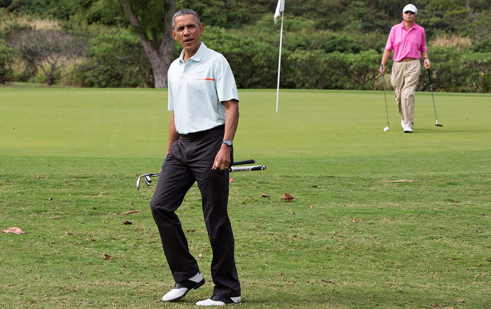 President Barack Obama plays golf with Malaysian Prime Minister Najib Razak, at Marine Corps Base Hawaii's Kaneohe Klipper Golf Course in Kaneohe, Hawaii during the Obama family vacation.