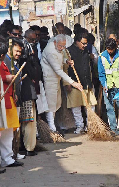 Prime Minister Narendra Modi during a cleanliness drive at Assi Ghat as part of Swachh Bharat Campaign, in Varanasi.