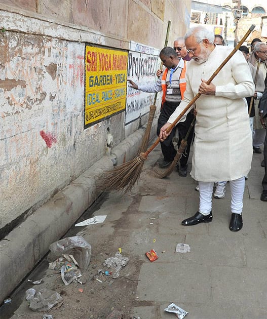 Prime Minister Narendra Modi during a cleanliness drive at Assi Ghat as part of Swachh Bharat Campaign, in Varanasi.