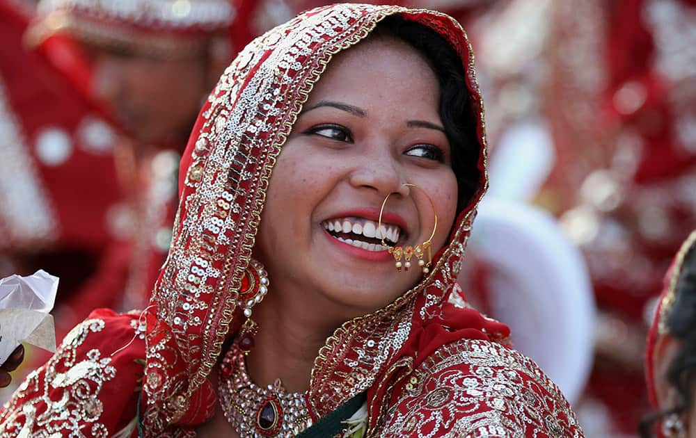 A Muslim bride smiles during a mass marriage in Ahmadabad.