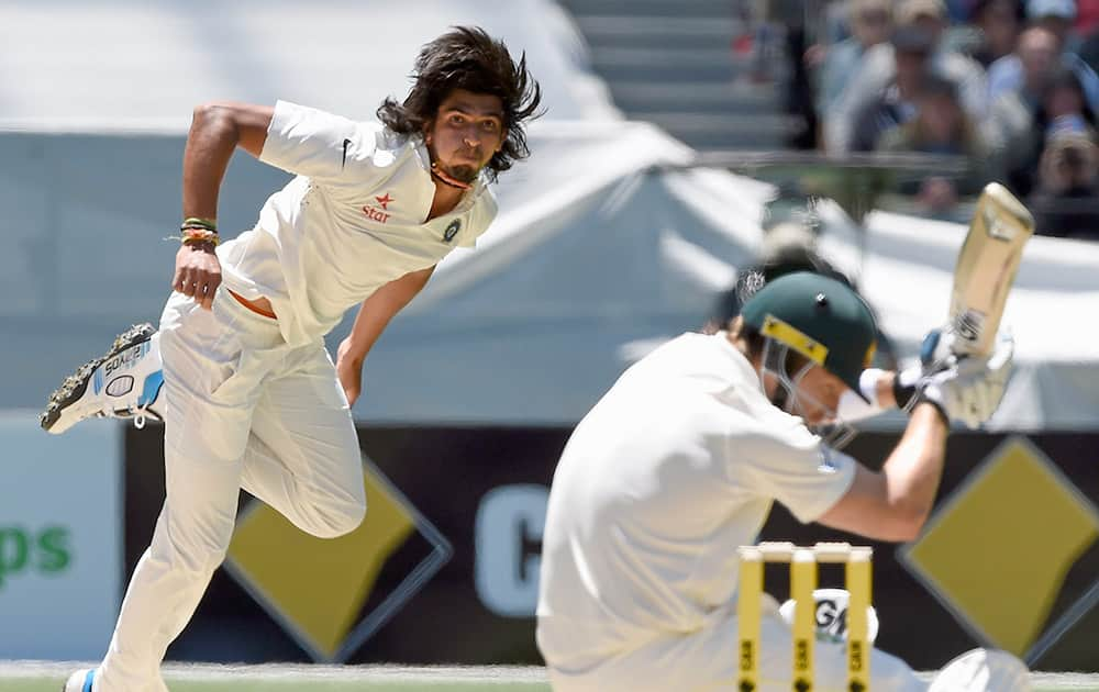 Ishant Sharma, bowls a bouncer to Australia's Shane Watson, during their play on day one of the third cricket test in Melbourne, Australia.