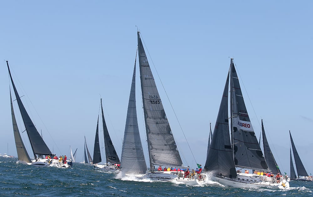 Competitors from mid-fleet make their way out Sydney Harbour during the start of the Sydney Hobart yacht race in Sydney.