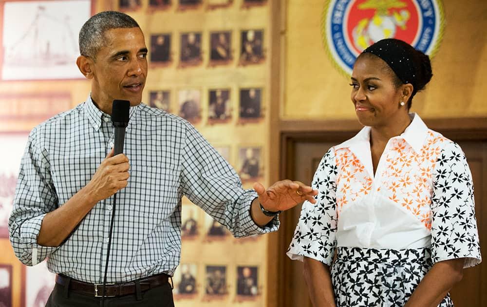 President Barack Obama, with first lady Michelle Obama, greets troops and their families on Christmas Day, at Marine Corps Base Hawaii in Kaneohe Bay, Hawaii during the Obama family vacation.