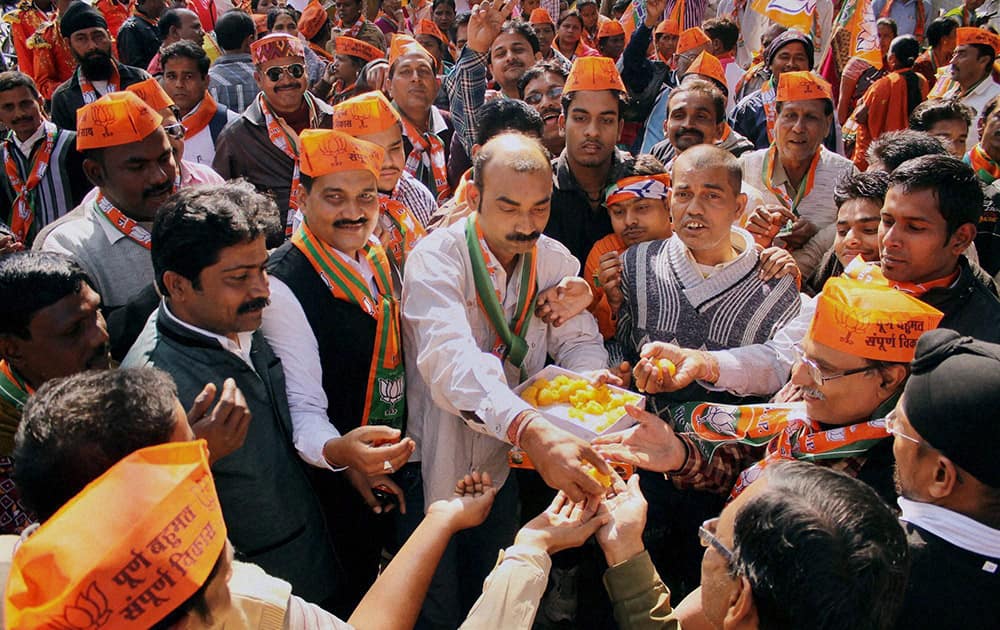 BJP supporters celebrate at Jamshedpur East, after Raghuvar Das elected as new Chief Minister of Jharkhand near his residence.