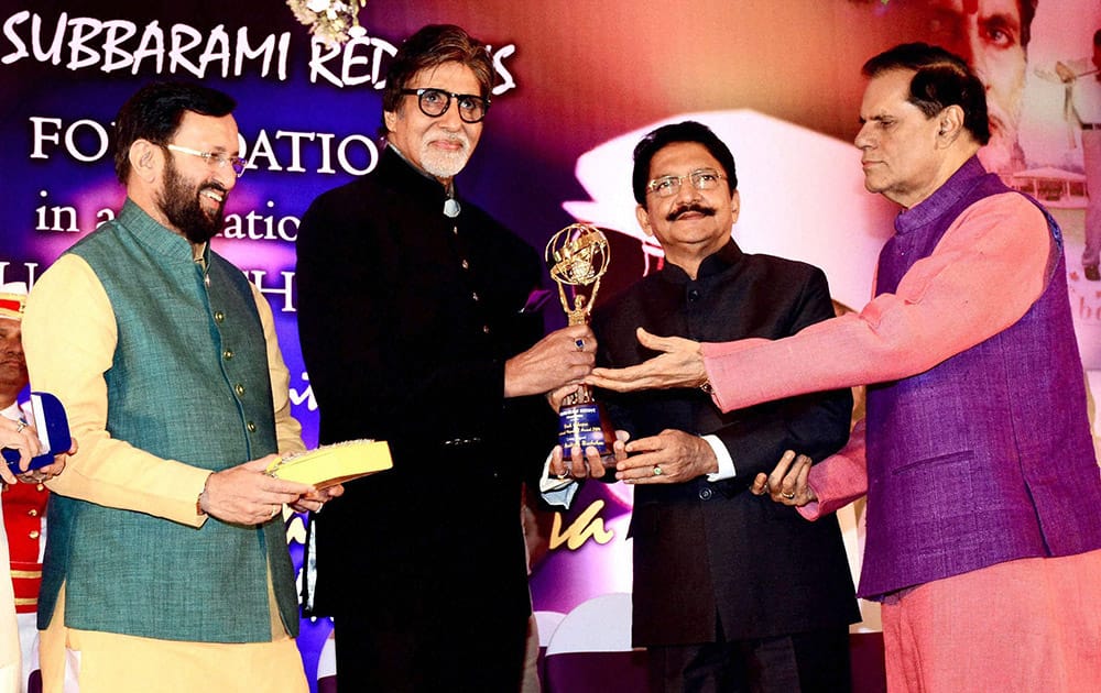 Bollywood actor Amitabh Bachchan receives the second Yash Chopra Memorial Award from Maharashtra Governor C Vidyasagar Rao in Mumbai. Also seen filmmaker T Subbarami Reddy and Prakash Javadekar, Union Minister for Environment and Information & Broadcasting.