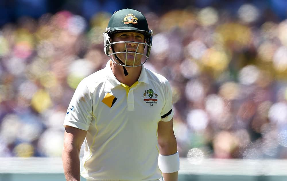 Australia's Brad Haddin walks off after he was caught behind for 55 runs against India during the second day of their cricket test match in Melbourne, Australia.