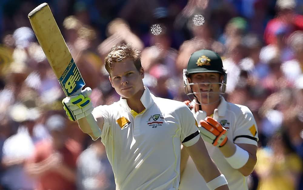 Australia's captain Steve Smith, celebrates after making 100 runs against India during the second day of their cricket test match in Melbourne, Australia.