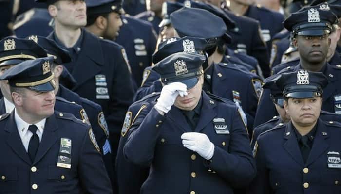 Thousands attend funeral of slain New York police officers