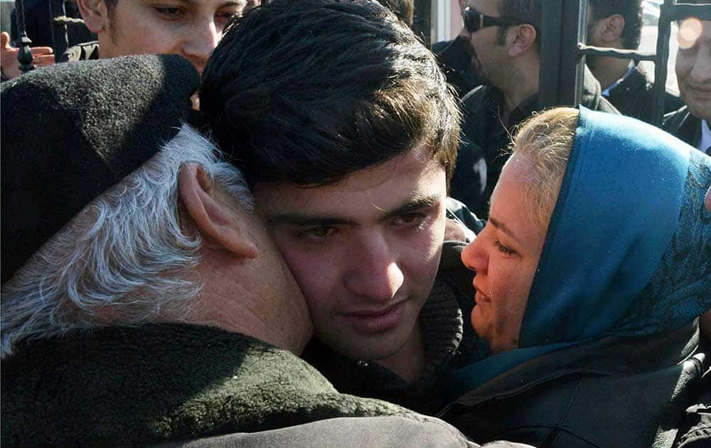 A Turkish teenager, known as M.E.A. is embraced by his parents after his release from the jail in Konya. Turkish media reports say a teenager was taken away from his school and detained by police for allegedly insulting Turkish President Recep Tayyip Erdogan. 