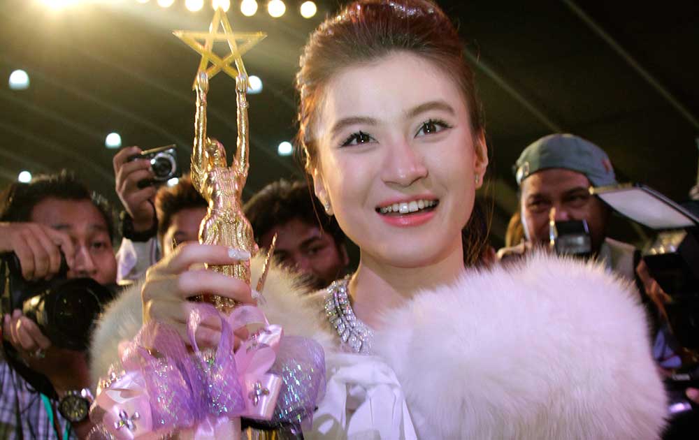 Wutt Hmone Shwe Yi, winner of Best Actress, poses with trophy during Myanmar Academy Awarding ceremony organized by Myanmar Motion Pictures Organization in Yangon, Myanmar.