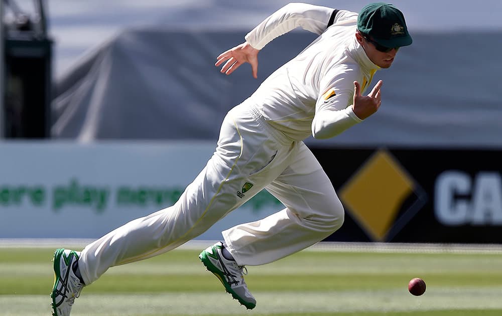 Australia's substitute fielder Peter Siddle drops a catching chance against India on the third day of their cricket test match in Melbourne, Australia.