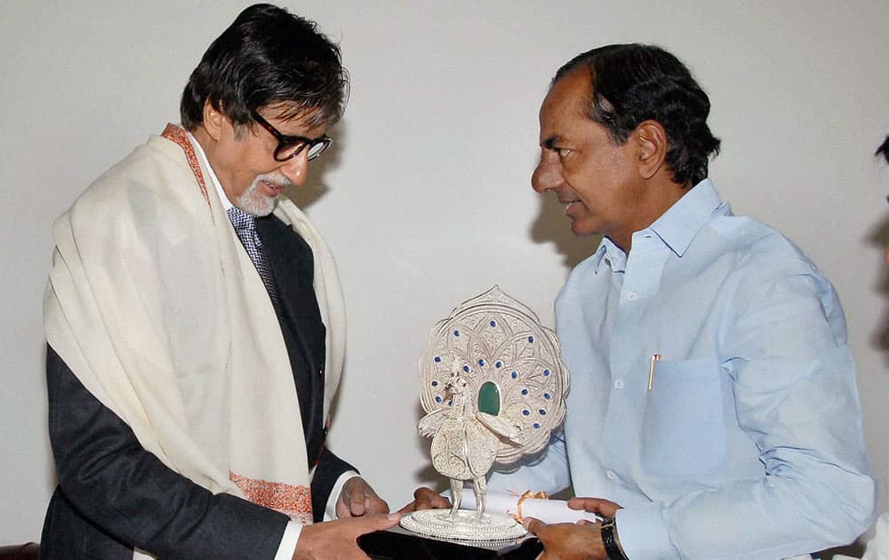 Telangana Chief Minister K. Chandrashekar Rao presents Akkineni Nageswara Rao award to Bollywood megastar Amitabh Bachchan, in Hyderabad.